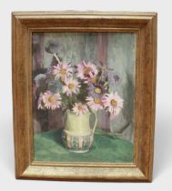 A late 19th/early 20th century still life study of flowers in a just, possibly a Poole Pottery