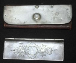 A Victorian silver pocket postage-stamp case, of rectangular form with foliate-engraved hinged front