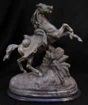 A large patinated spelter figure of a rearing horse on oval base. (tail as found), 56cm high