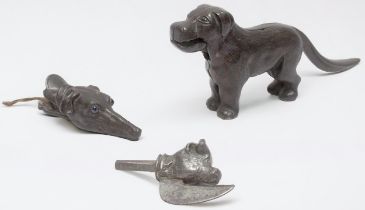 A 19th century 'bronzed' iron Greyhound paper-clip with glass eyes, together with an iron novelty