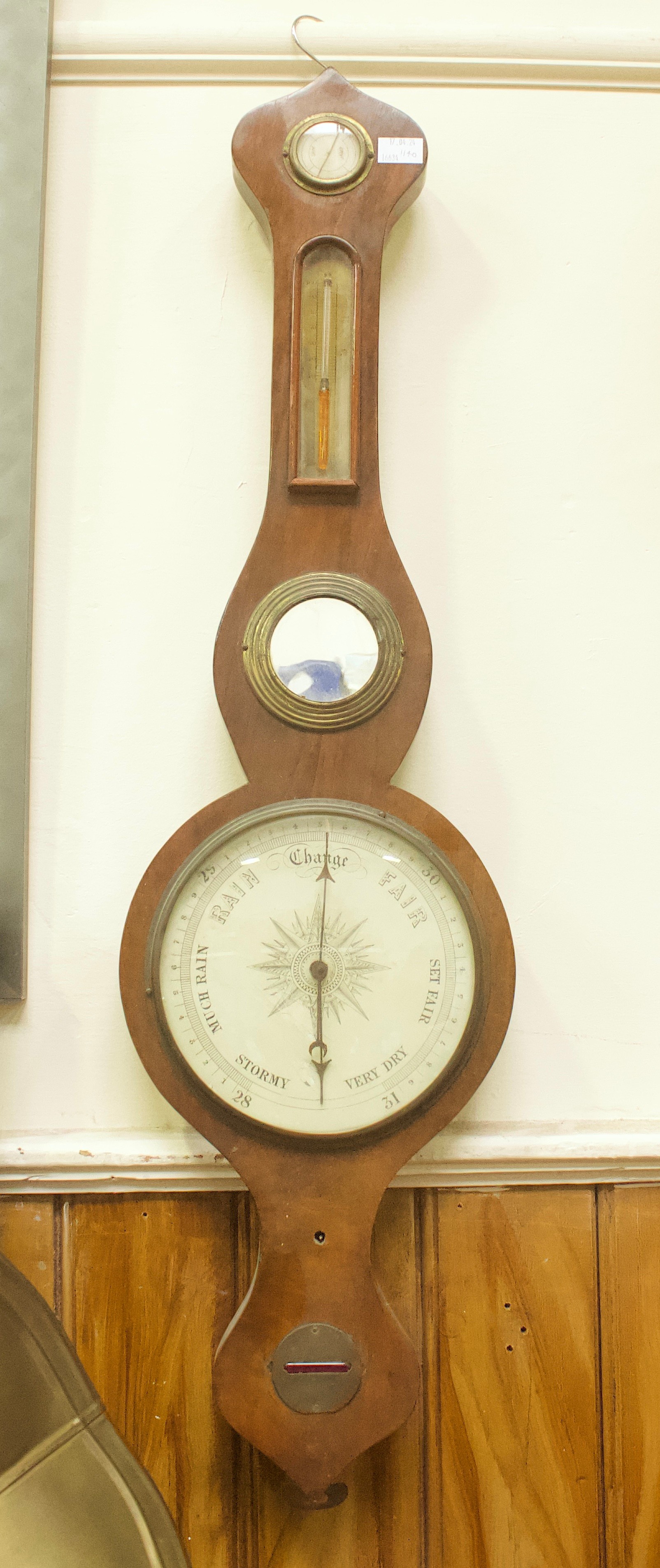 A 19th century mercury wheel barometer with thermoimeter, hygrometer and spirit level, 95cm (A/F)