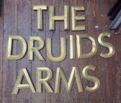 A collection of 13 gilded resin advertising letters, spelling out ‘The Druids Arms’, each letter