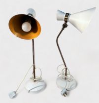 A pair of modern table lamps with adjustable lacquered brass standards, white-painted metal bases