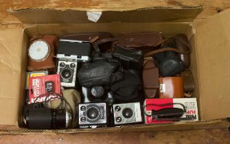 A collection of assorted cameras and lenses including a Zeiss Ikon Contessa and Kodak brownies, a