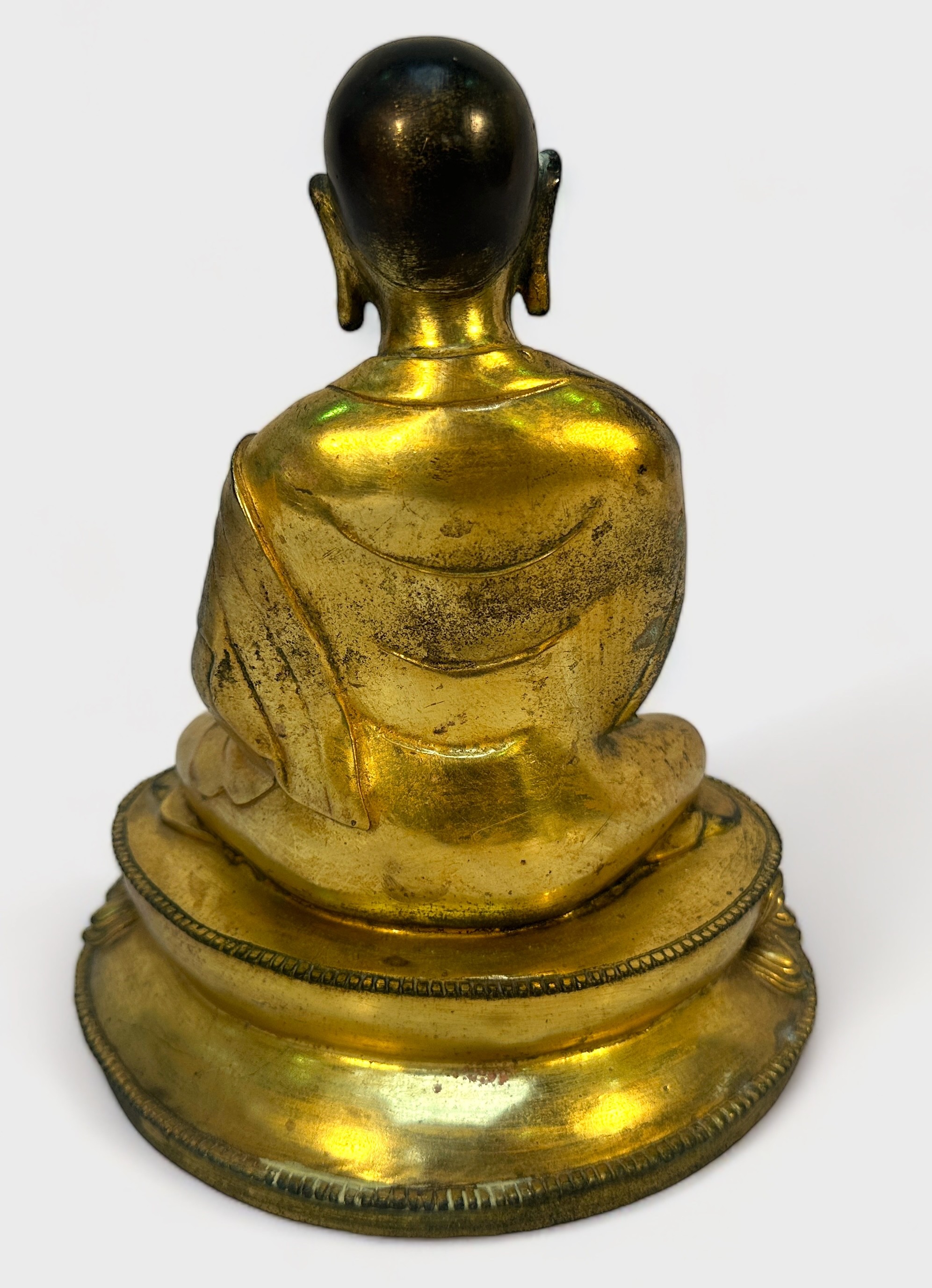 A Gilt-bronze Tibetan style Buddha, seated in lotus position and holding a vajra and meditiation - Image 2 of 14