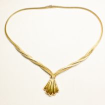 A 9ct yellow gold flat, triple, snake-link necklace, with integrated fan design pendant, with