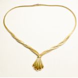 A 9ct yellow gold flat, triple, snake-link necklace, with integrated fan design pendant, with