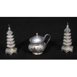 A pair of Chinese Export Silver Pagoda pepper pots by Wang Hing, 8cm high, together with a mustard