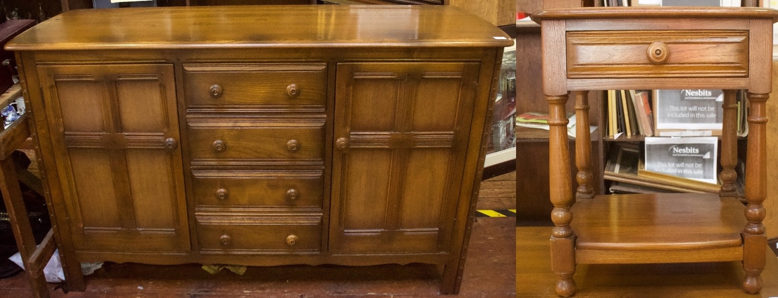 An Ercol elm Colonial sideboard, comprising four short central drawers, flanked by two cupboard