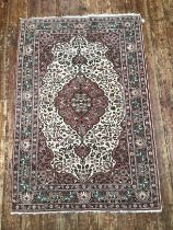 A Persian design hand-knotted medallion rug with Shah Abbas floral border and all-over stylized