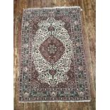 A Persian design hand-knotted medallion rug with Shah Abbas floral border and all-over stylized