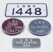 Four various cast iron wagon plates, including an LNWR Crane Plate number ‘1448’, and three L.M.S.