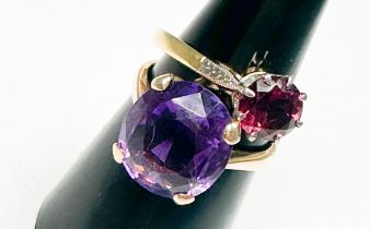 A 9ct yellow gold dress ring, claw set with a large oval shaped amethyst, measuring 14mm x 12mm,