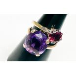 A 9ct yellow gold dress ring, claw set with a large oval shaped amethyst, measuring 14mm x 12mm,