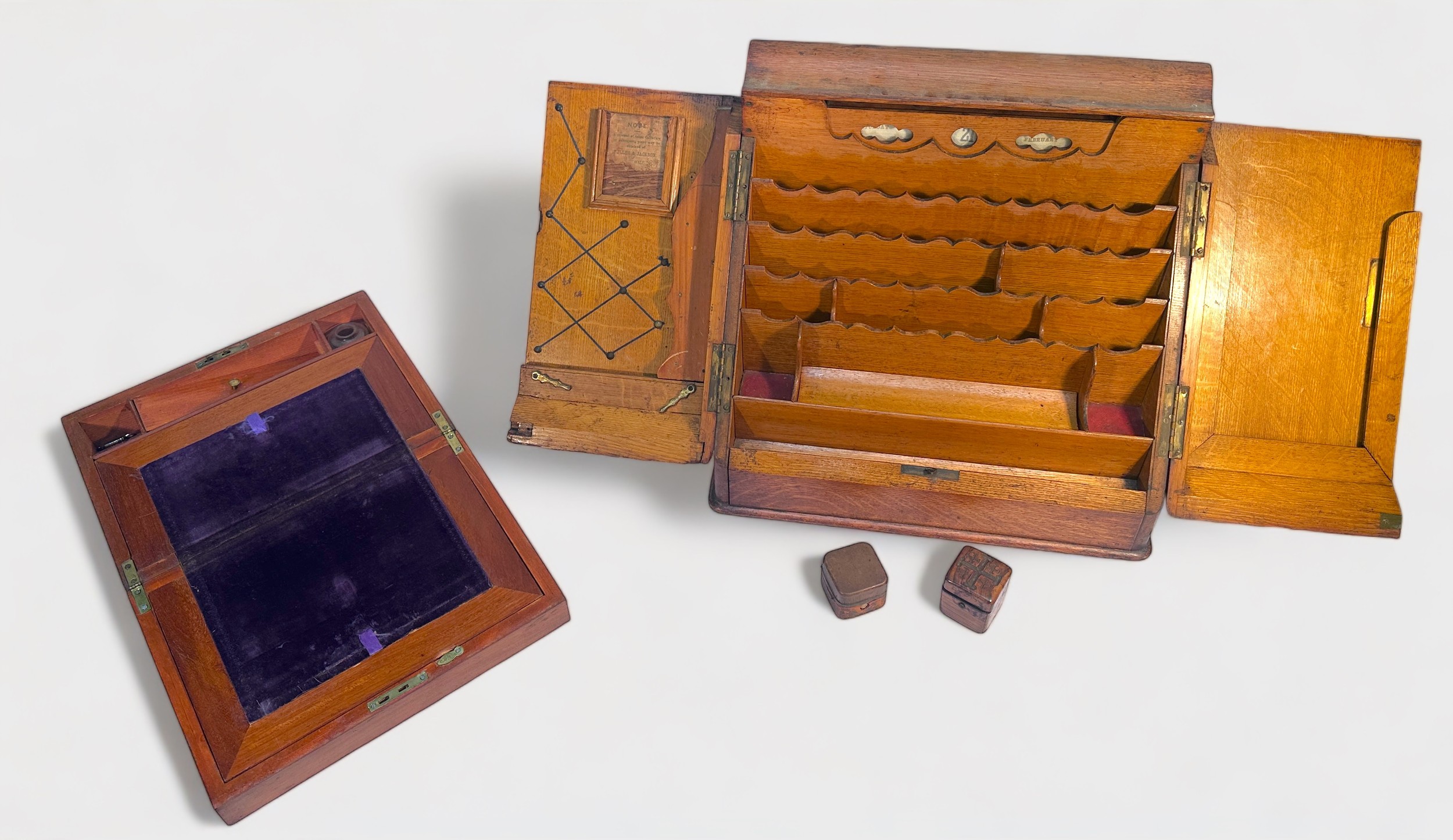 A Victorian slope-fronted oak desk tidy, with a pair of hinged doors enclosing adjustable