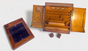 A Victorian slope-fronted oak desk tidy, with a pair of hinged doors enclosing adjustable