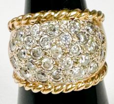 A 9ct yellow gold wide band dress ring, set with white faceted stones, weight 6.9 grams.