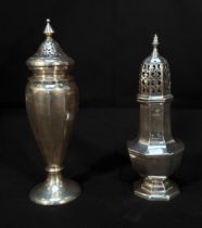 Two George V silver sugar casters, one of inverted baluster form with vertical panelled sides,