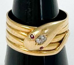 An 18ct gold ring, modelled as a coiled serpent with an old cut diamond set to the head, estimated