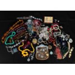 A collection of assorted vintage and antique costume jewellery and accessories including beads,