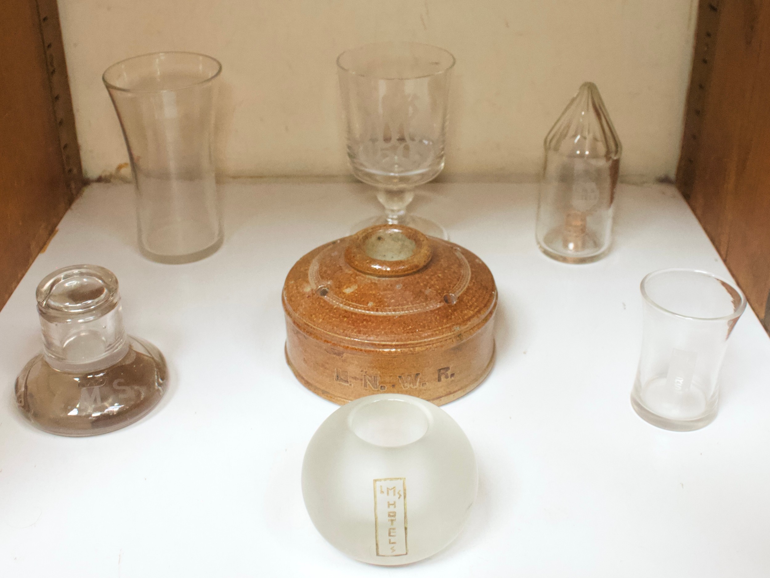 A collection of British Rail (LMS) glass wares, comprising a cut glass sugar dispenser, of conical