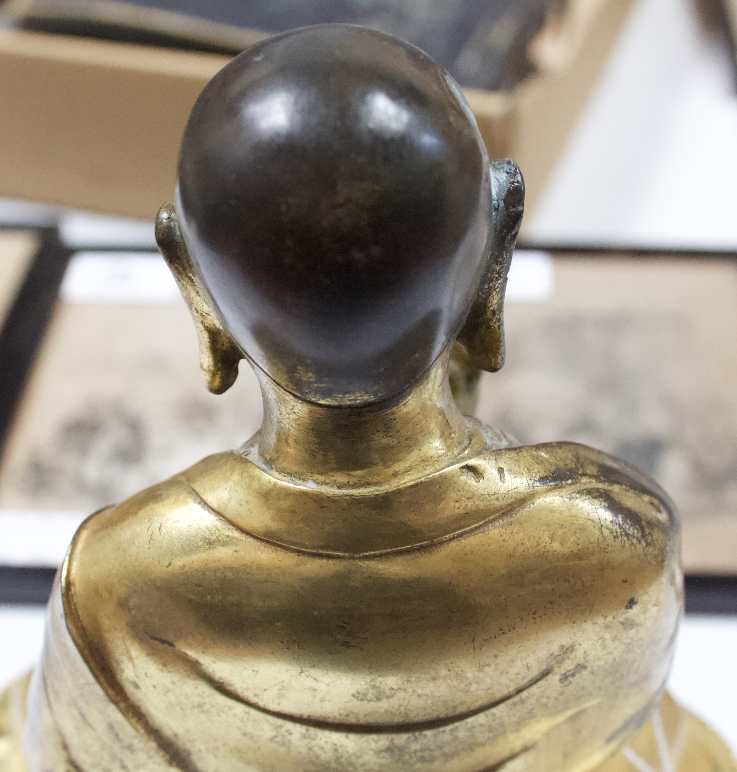 A Gilt-bronze Tibetan style Buddha, seated in lotus position and holding a vajra and meditiation - Image 8 of 14