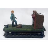 A painted cast iron novelty mechanical money bank or box, Football Bank, modelled as a footballer