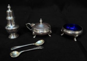 A Three-piece silver condiment set of open circular salt, mustard with hinged cover and a baluster