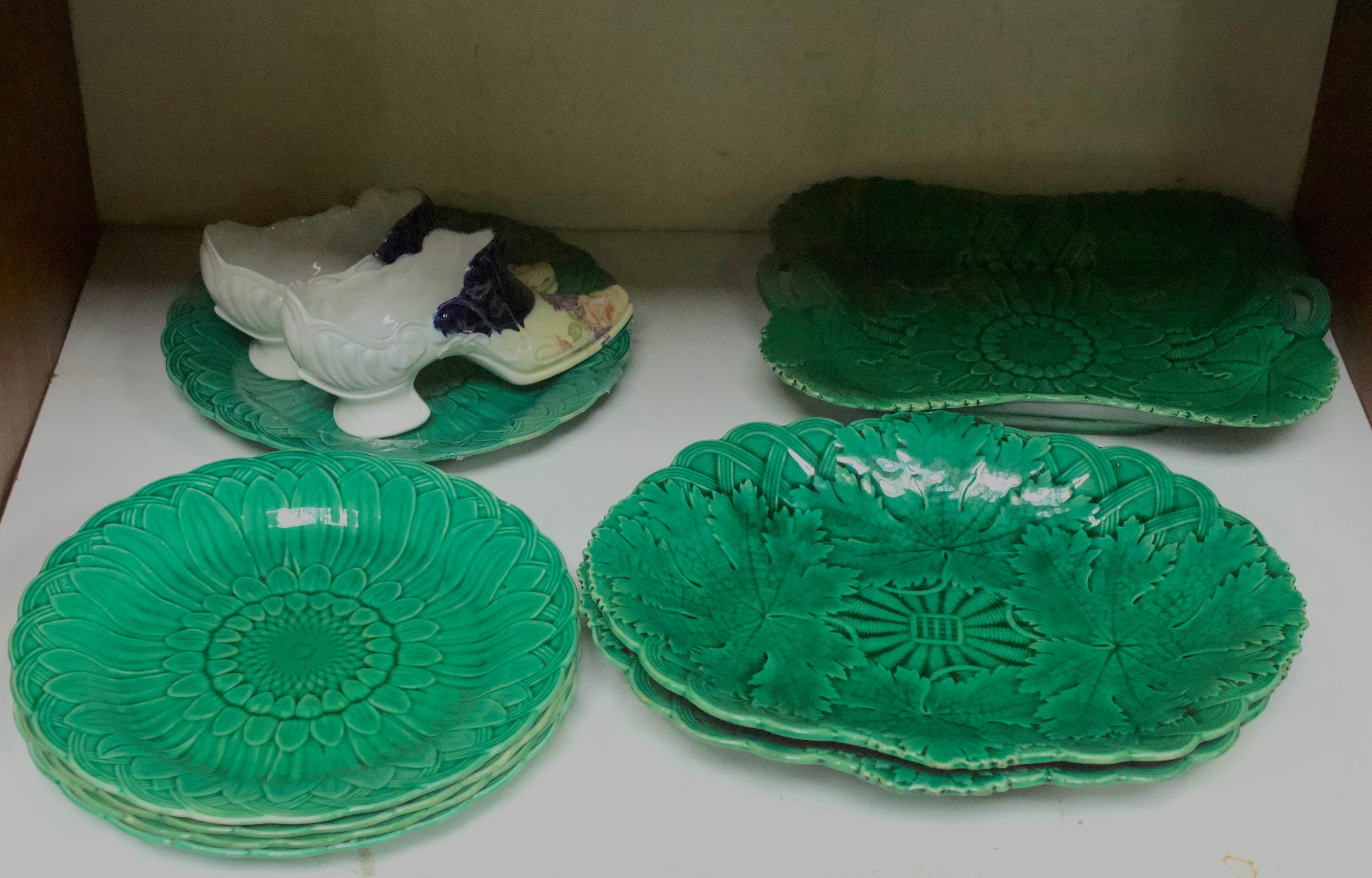 A collection of late 19th/early 20th Century Wedgwood majolica leaf-moulded plates and dishes,