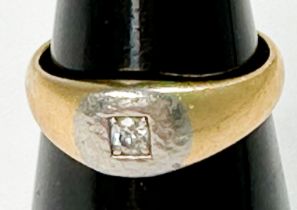 An 18ct gold ring, set with a small round diamond, estimated 0.05cts, ring weighs 6.6 grams.