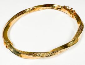 A 9ct yellow gold bracelet in a Greek key twist design, weighs 7.1 grams.