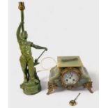 A late 19th Century French onyx and spelter figural figural mantel clock, converted to a lamp,