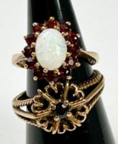 An Opal and garnet 9ct yellow gold dress ring and another, total weight 7.8 grams. (2)