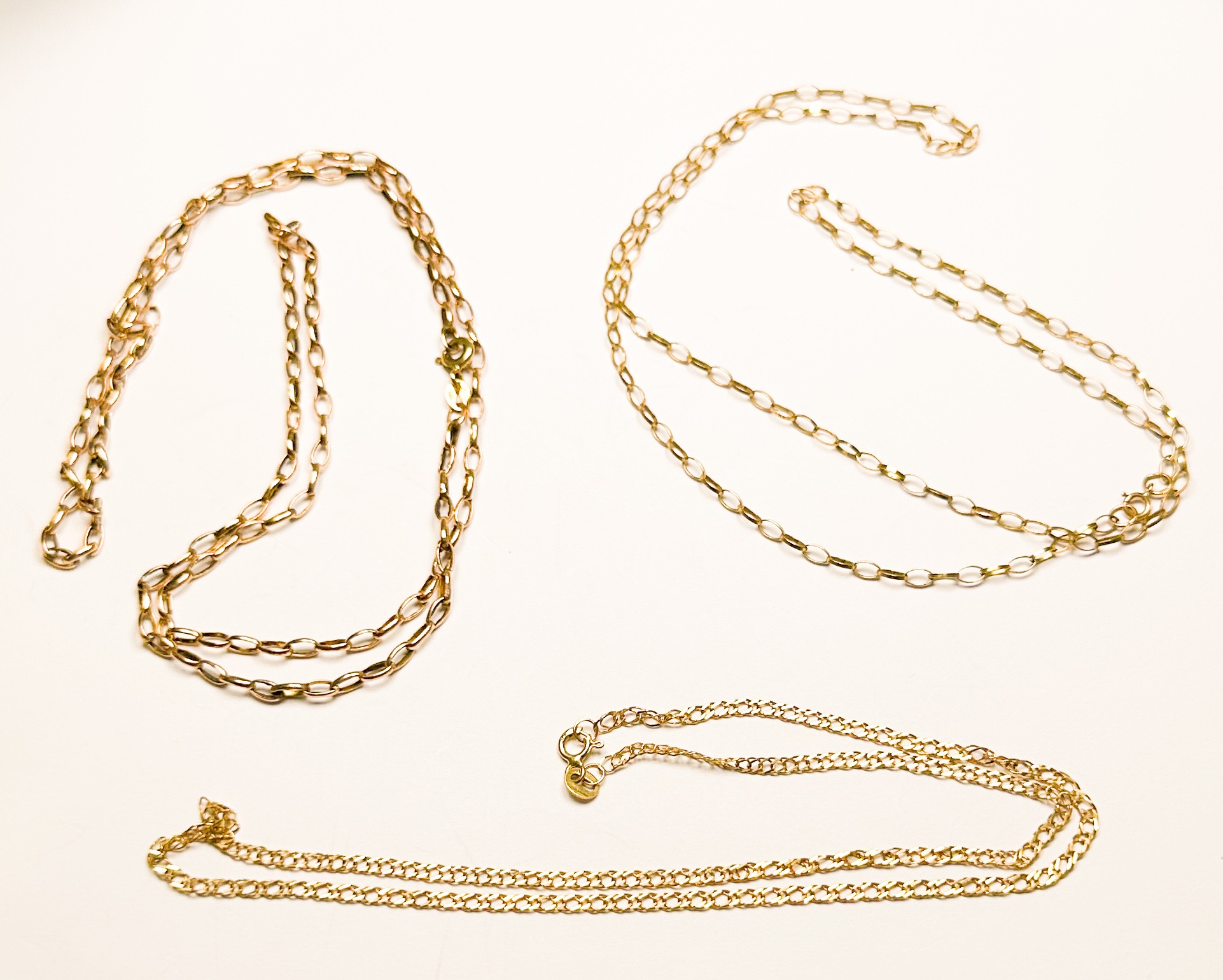 Three 9ct gold chains, together with a pair of 9ct yellow gold earrings, total weight 8.5 grams. - Image 2 of 2