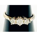 A 9ct yellow gold ring, claw set with 3 x round diamonds, estimated total diamond weight 0.33cts,