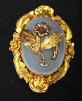 A Victorian yellow metal brooch, (tests as 14ct gold or above), centrally set with an oval moonstone