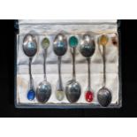 A part set of five silver coffee spoons by Liberty & Co, with hardstone finals including