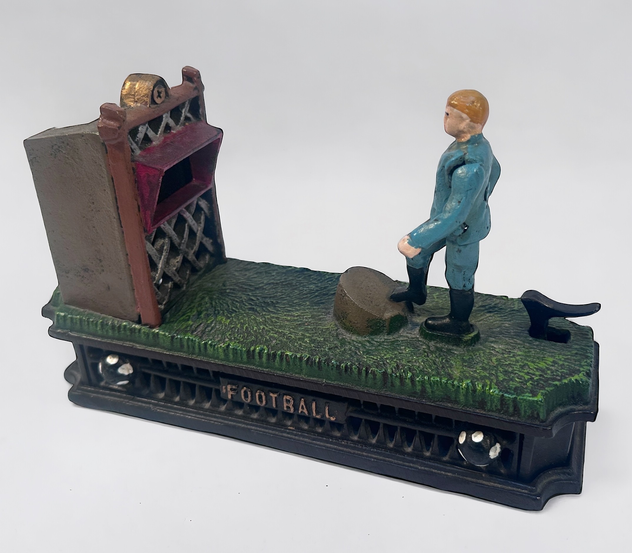 A painted cast iron novelty mechanical money bank or box, Football Bank, modelled as a footballer - Image 2 of 2