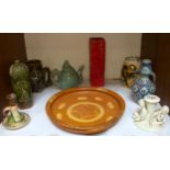 A slipware pottery dish, a Korean 'Koryo' tepot, red lava vase, angel chamberstick and other
