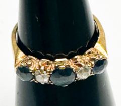 An 18ct yellow gold sapphire and diamond ring, set with three faceted sapphires and two Victorian