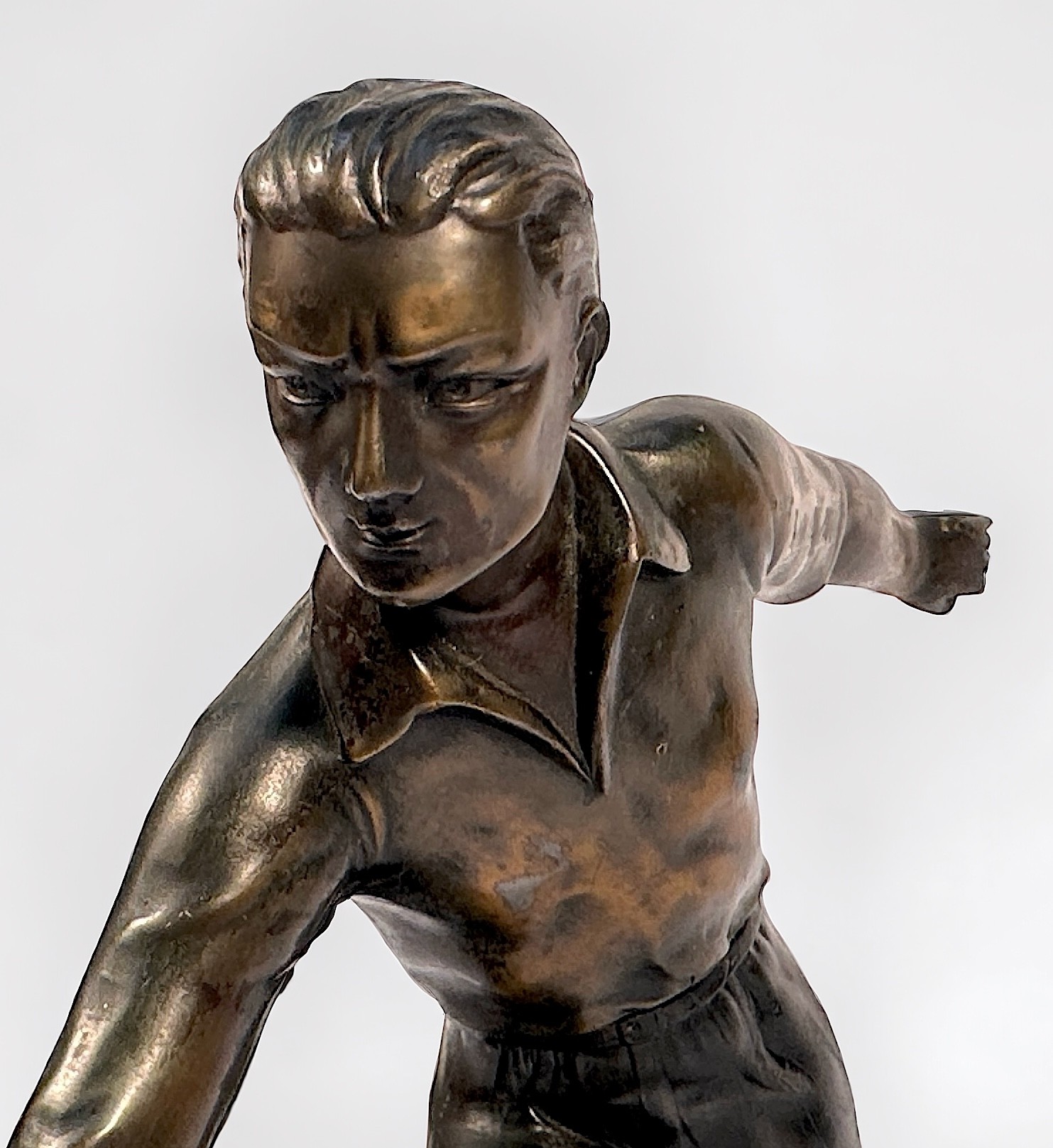 A bronzed metal sculpture of a man playing Pétanque, raised on marble base, 38cm long - Image 3 of 3