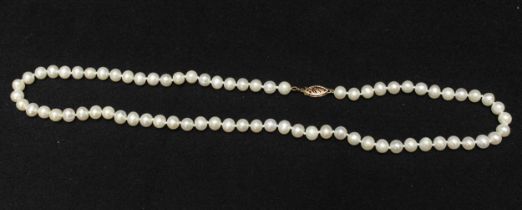 A string of cultured pearls, with 10k gold clasp, 45cm long