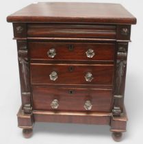 A mahogany table top chest of three graduated drawers with clear plastic pulls, pulvinated frieze