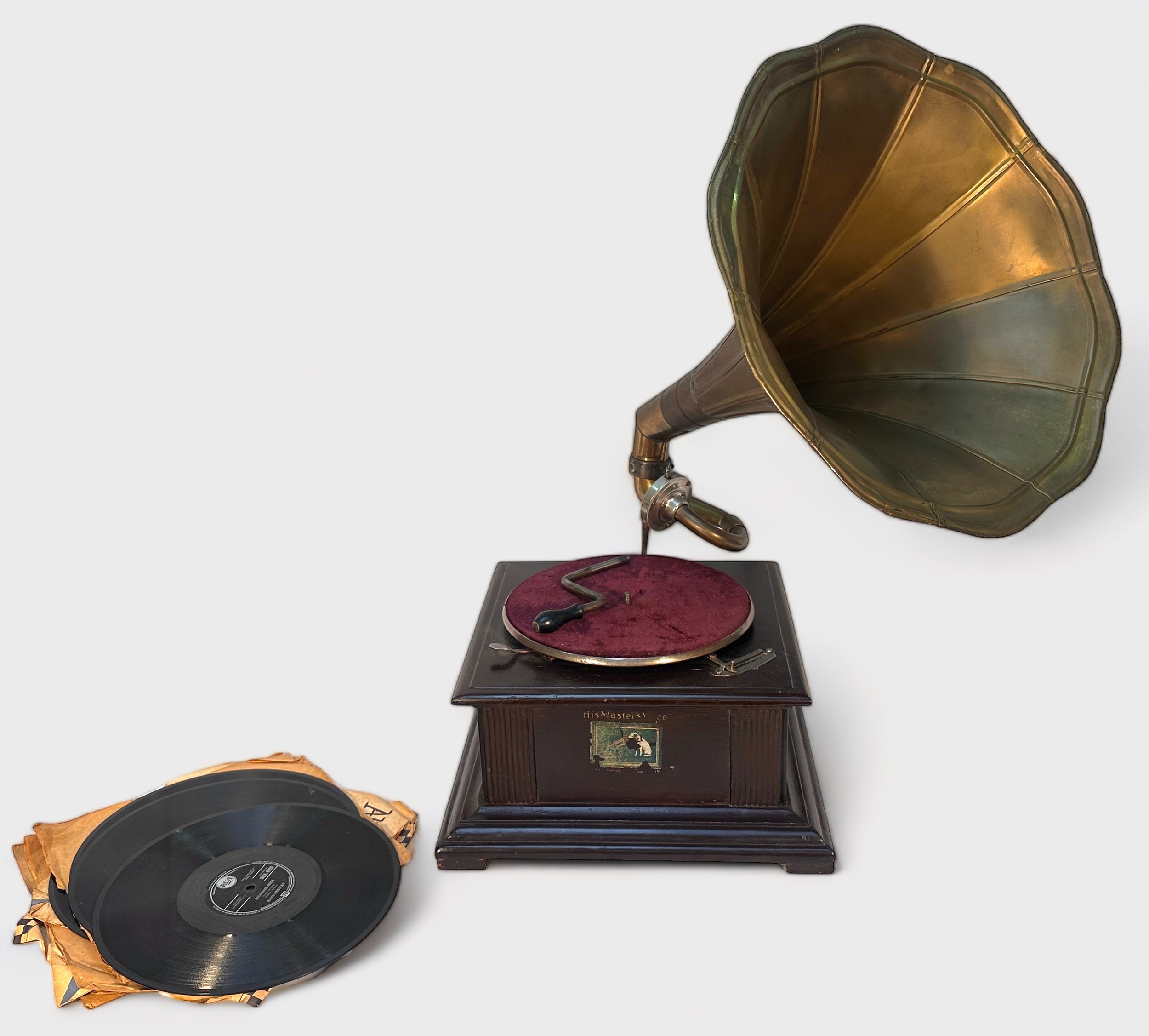 A stained wooden His Masters Voice gramophone, with brass horn, together with eight Elvis Presley 78