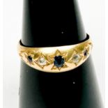 An 18ct yellow gold gypsy style ring, star-set with 3 x sapphires and 2 x diamonds, hallmarked