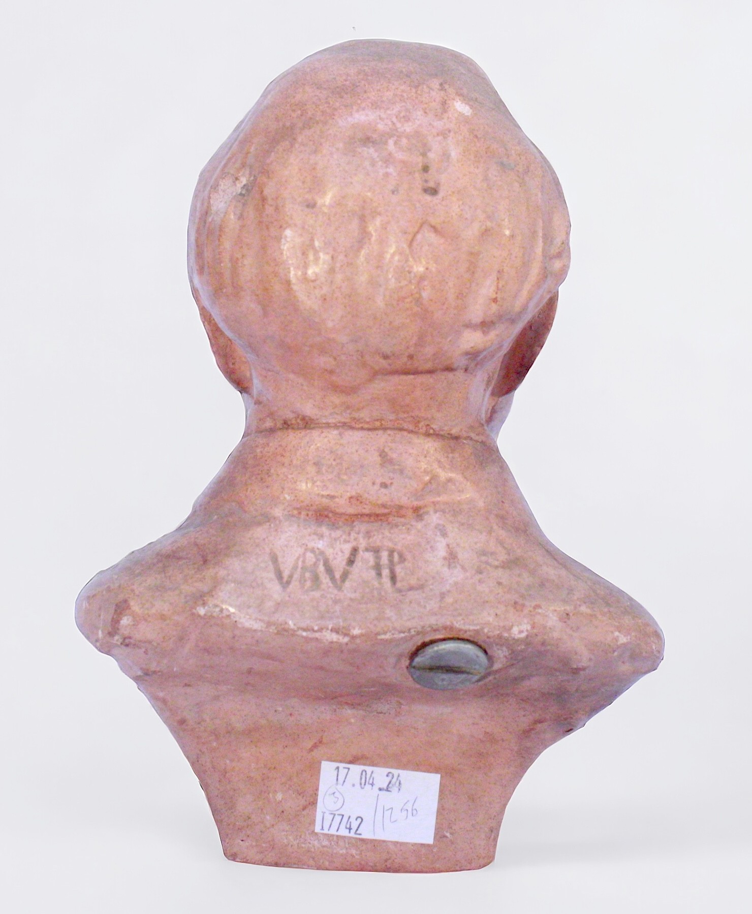 A terracotta bust of Winston Churchill smoking a cigar, with etched initials to back, 21cm tall, - Image 2 of 2