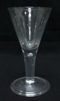 An 18th Century hand-Blown English Ale Glass, with one-piece trumper bowl and drawn teardrop stem,