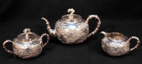 A Chinese Export three-piece white-metal teaset, (tests as .800 silver or higher), of globular