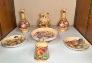 Seven pieces of Aynsley 'Orchard Gold porcelain including a pair of spill vases, pair of small