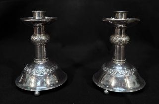 A Pair of Arts & Crafts Silver Candlesticks by the Guild of Handicraft, with inverted integral